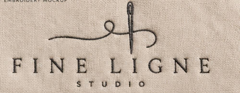 The mark, embroidered — the wordmark rendered in the studio's own medium.