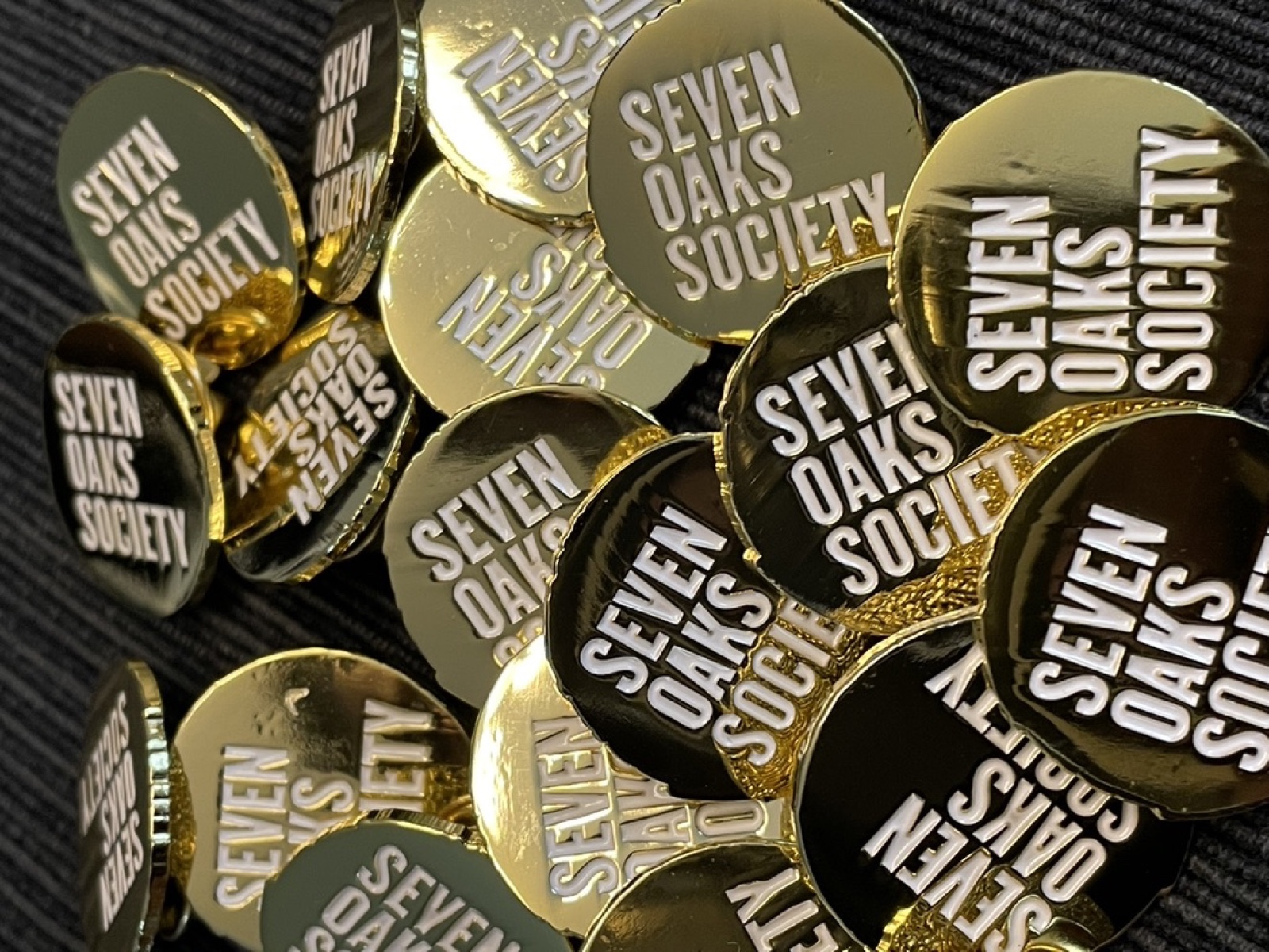 Identity in use — enamel pins.